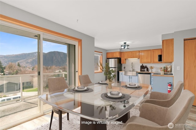 342 N Shore Ct Unit C, Manson, WA 98831 - dining space featuring a mountain view and light wood finished floors
