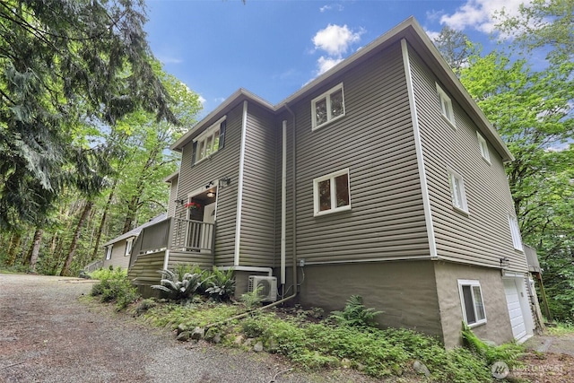 24010 SE 168th St, Issaquah, WA 98027 - view of property exterior featuring a garage, ac unit, and driveway