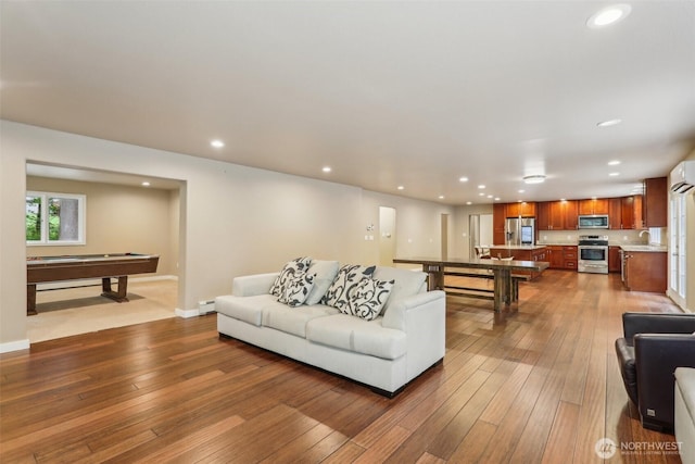 24010 SE 168th St, Issaquah, WA 98027 - living room with pool table, a wall unit AC, dark wood-type flooring, a baseboard radiator, and recessed lighting