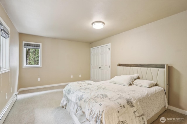 24010 SE 168th St, Issaquah, WA 98027 - carpeted bedroom featuring a baseboard heating unit, baseboards, and a closet