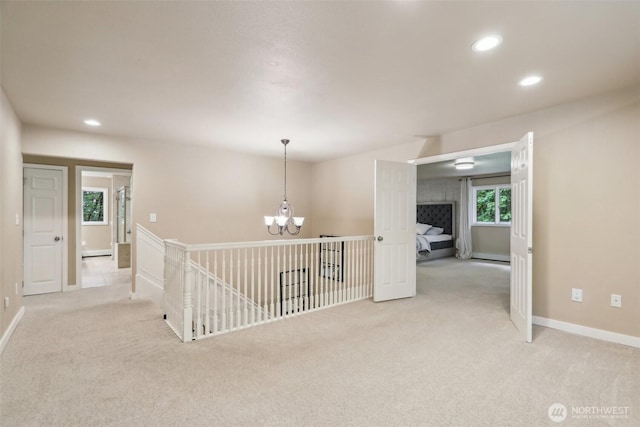 24010 SE 168th St, Issaquah, WA 98027 - hall with a chandelier, light colored carpet, recessed lighting, an upstairs landing, and baseboards