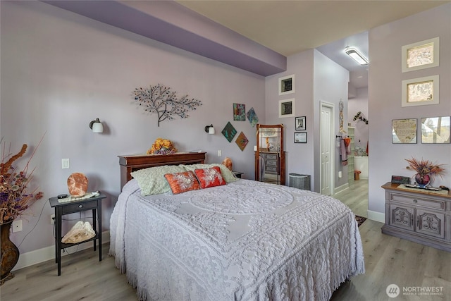400S Meridian Unit 2A, Puyallup, WA 98371 - bedroom featuring baseboards, light wood-style flooring, and a closet