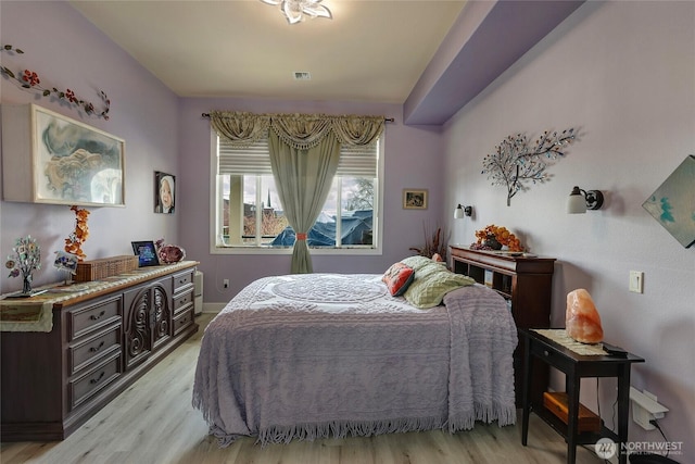 400S Meridian Unit 2A, Puyallup, WA 98371 - bedroom featuring baseboards, light wood-style floors, and visible vents