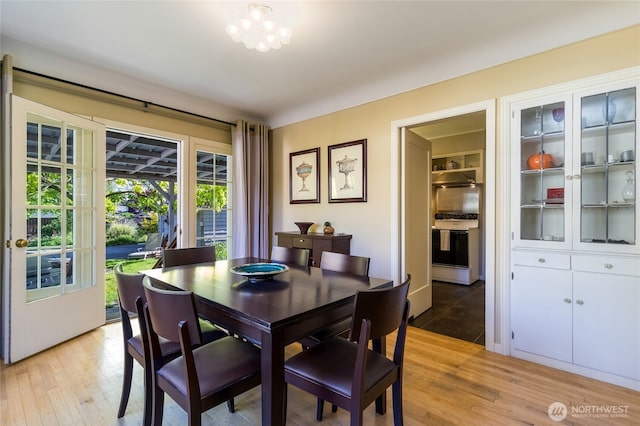dining space with light wood-style floors