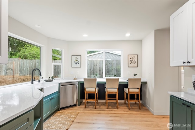 19713 17th St SW, Lakebay, WA 98349 - kitchen featuring green cabinets, dishwasher, light wood-style flooring, a sink, and recessed lighting