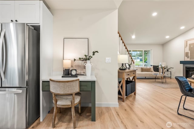 19713 17th St SW, Lakebay, WA 98349 - kitchen with freestanding refrigerator, light wood-style flooring, white cabinetry, recessed lighting, and open floor plan