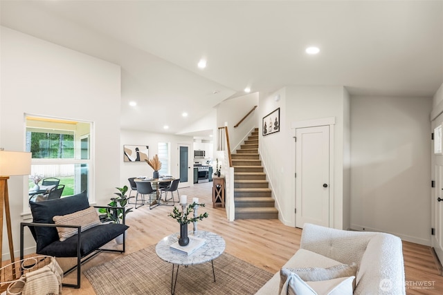 19713 17th St SW, Lakebay, WA 98349 - living area featuring stairs, light wood-type flooring, baseboards, recessed lighting, and vaulted ceiling