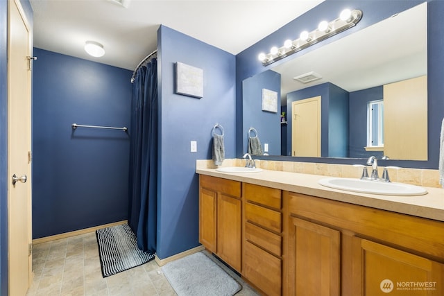 231 E Heights Pl N, Belfair, WA 98528 - bathroom with double vanity and baseboards