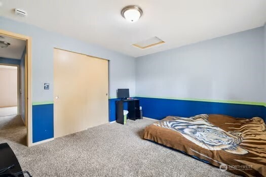 231 E Heights Pl N, Belfair, WA 98528 - bedroom featuring carpet flooring and attic access