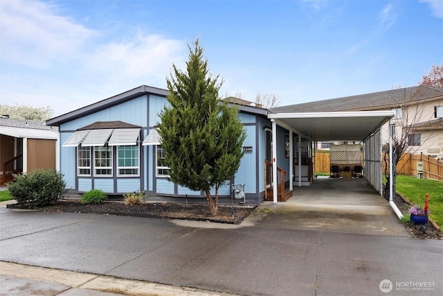1340 Gloria Ln, Walla Walla, WA 99362 - manufactured / mobile home with fence, an attached carport, and driveway
