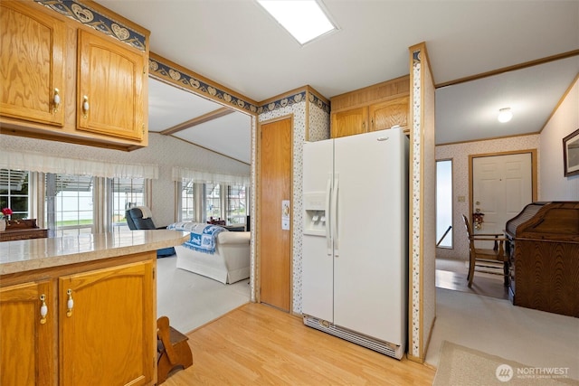 1340 Gloria Ln, Walla Walla, WA 99362 - kitchen with open floor plan, vaulted ceiling, white fridge with ice dispenser, and wallpapered walls