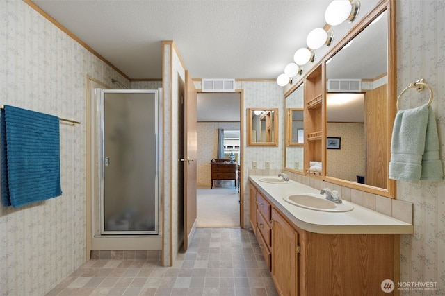 1340 Gloria Ln, Walla Walla, WA 99362 - bathroom featuring visible vents, a sink, and wallpapered walls