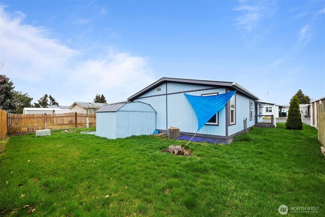 1340 Gloria Ln, Walla Walla, WA 99362 - back of property with a yard, fence, and an outdoor structure