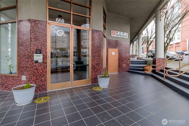 668S Lane St Unit 702, Seattle, WA 98104 - property entrance with stucco siding and a porch