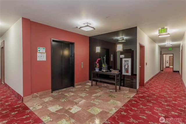 668S Lane St Unit 702, Seattle, WA 98104 - hallway with elevator and baseboards