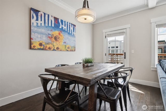 211 Market St, Pacific Beach, WA 98571 - dining space with crown molding, baseboards, and dark wood-style floors