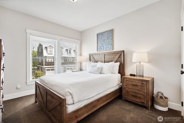 211 Market St, Pacific Beach, WA 98571 - bedroom featuring dark colored carpet and baseboards