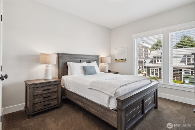 211 Market St, Pacific Beach, WA 98571 - bedroom featuring dark carpet and baseboards