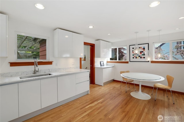 3754 SW 107th St, Seattle, WA 98146 - kitchen with a sink, healthy amount of natural light, white cabinetry, modern cabinets, and recessed lighting