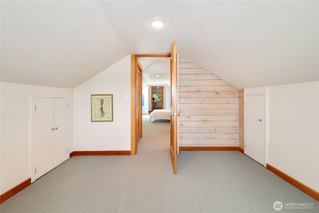 3754 SW 107th St, Seattle, WA 98146 - bonus room featuring lofted ceiling, light colored carpet, baseboards, and wooden walls