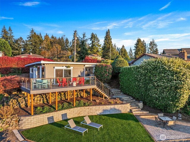 4425 Paradise Ave W, University Place, WA 98466 - rear view of house featuring a wooden deck, a yard, and stairway