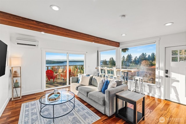 4425 Paradise Ave W, University Place, WA 98466 - living room with a wall mounted AC, beam ceiling, recessed lighting, wood finished floors, and baseboards