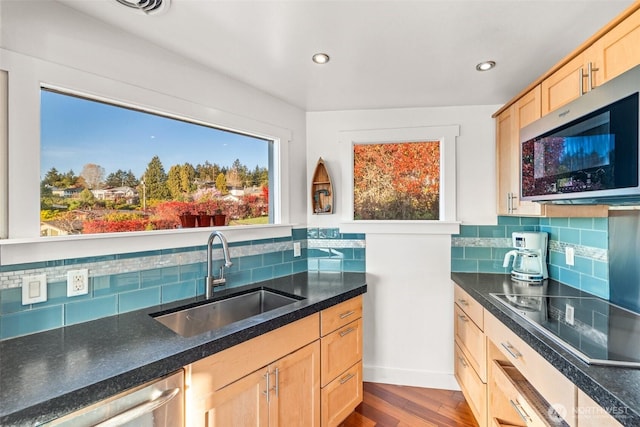4425 Paradise Ave W, University Place, WA 98466 - kitchen featuring appliances with stainless steel finishes, a sink, light brown cabinets, dark wood finished floors, and tasteful backsplash