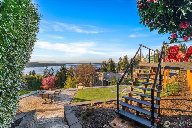 4425 Paradise Ave W, University Place, WA 98466 - view of jungle gym featuring a patio, stairway, a water view, and a lawn