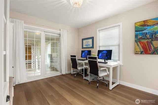 office featuring baseboards and wood finished floors
