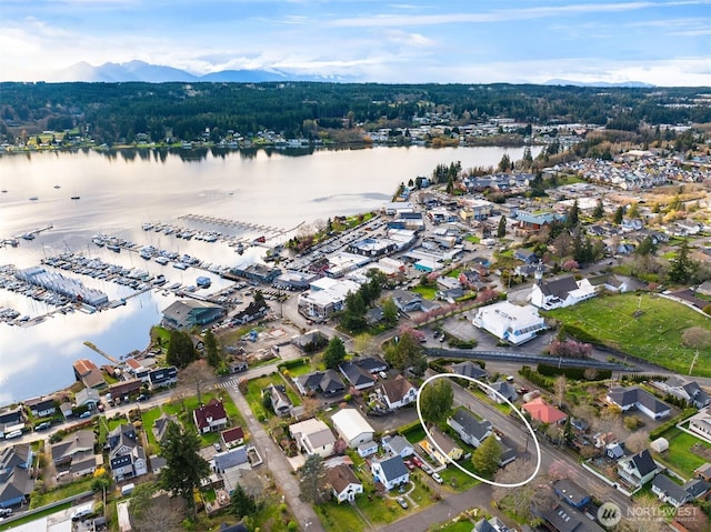 birds eye view of property featuring a water view