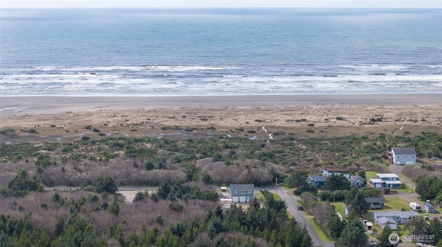 33 4th Ave, Ocean Shores, WA 98569 - drone / aerial view featuring a beach view and a water view