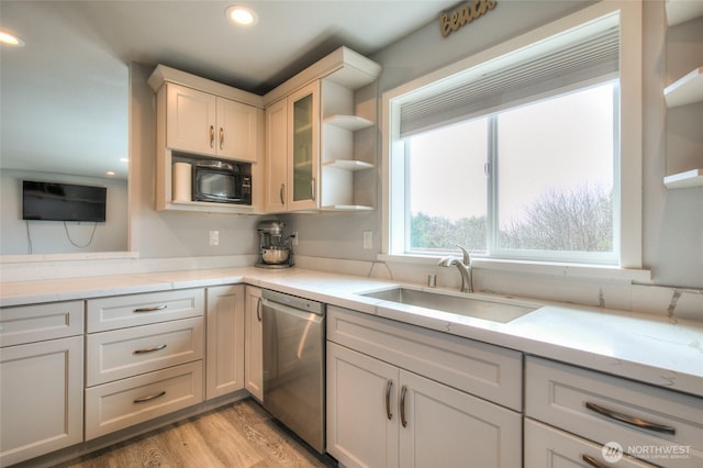 33 4th Ave, Ocean Shores, WA 98569 - kitchen with a sink, open shelves, black microwave, stainless steel dishwasher, and light wood-type flooring