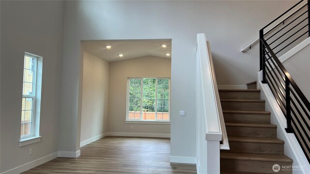 6414 213th Avenue Ct E, Bonney Lake, WA 98391 - staircase featuring wood finished floors, recessed lighting, and vaulted ceiling