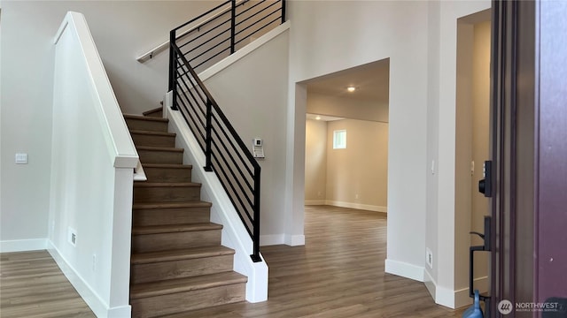 6414 213th Avenue Ct E, Bonney Lake, WA 98391 - stairs featuring wood finished floors and baseboards