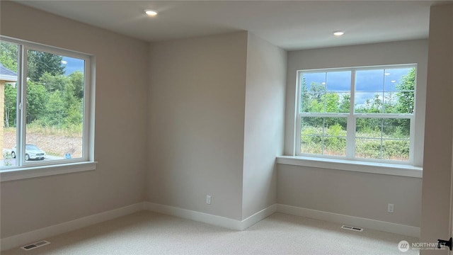 6414 213th Avenue Ct E, Bonney Lake, WA 98391 - spare room featuring healthy amount of natural light, light carpet, and recessed lighting