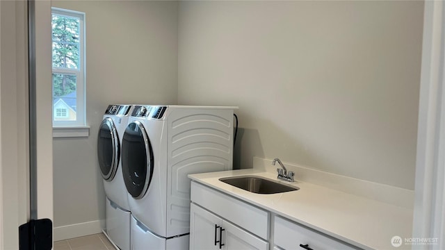 6414 213th Avenue Ct E, Bonney Lake, WA 98391 - washroom featuring washer and clothes dryer, cabinet space, and light tile patterned floors