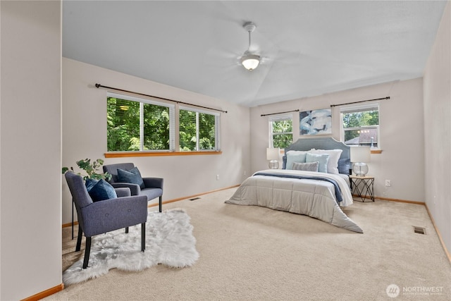bedroom with baseboards, carpet floors, and vaulted ceiling