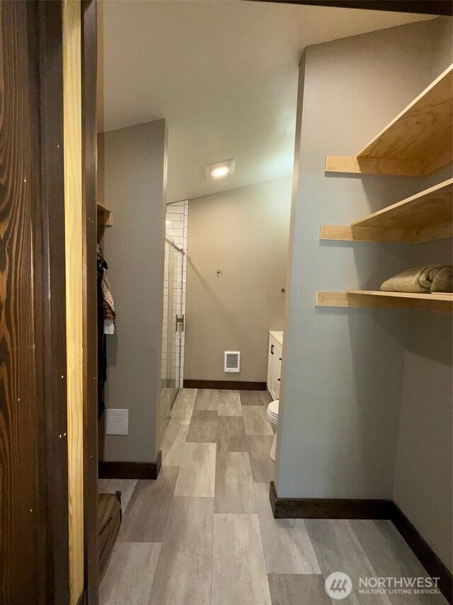 21 Twin Lakes Dr, Winthrop, WA 98862 - washroom featuring baseboards and light wood-style flooring