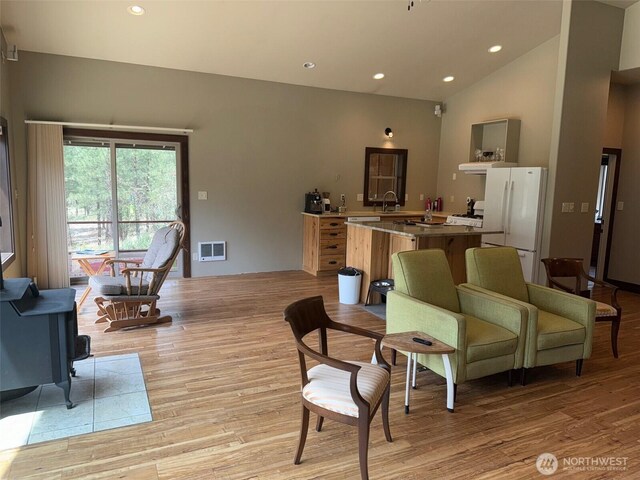 21 Twin Lakes Dr, Winthrop, WA 98862 - living room with light wood-type flooring, recessed lighting, and high vaulted ceiling