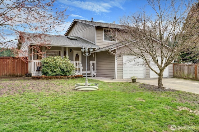 view of front facade with a front yard, roof with shingles, concrete driveway, and fence