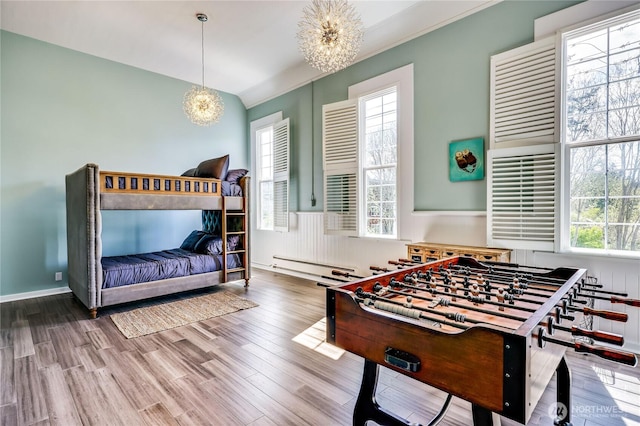 8494 NE Odd Fellows Rd, Bainbridge Island, WA 98110 - interior space with a chandelier, lofted ceiling, wood finished floors, and a wealth of natural light