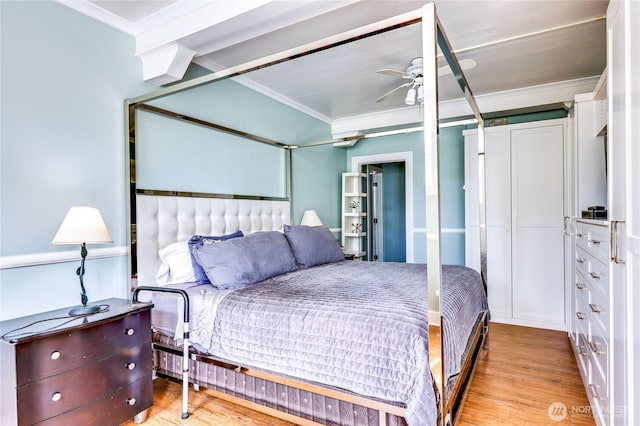 bedroom with crown molding and light wood-type flooring