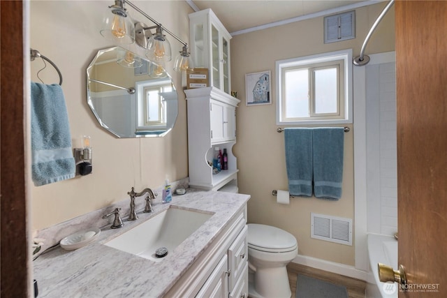 2824 Pacific Ave, Hoquiam, WA 98550 - bathroom featuring toilet, vanity, bathing tub / shower combination, and visible vents