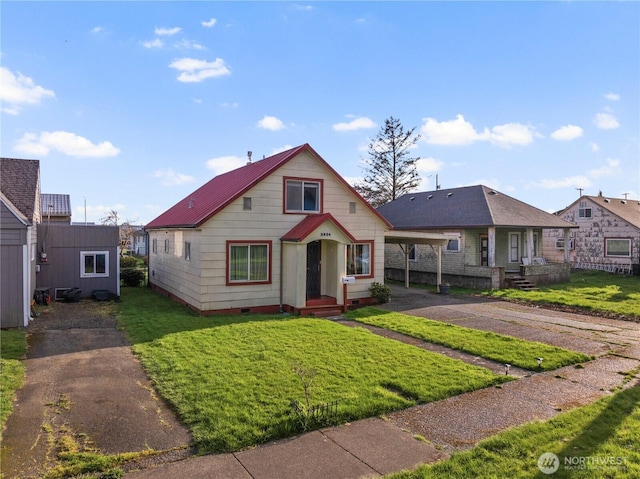 2824 Pacific Ave, Hoquiam, WA 98550 - bungalow with driveway, a front lawn, crawl space, and a carport