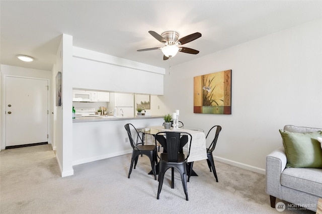 130 NE 95th St Unit A203, Seattle, WA 98115 - dining area with baseboards, ceiling fan, and light carpet