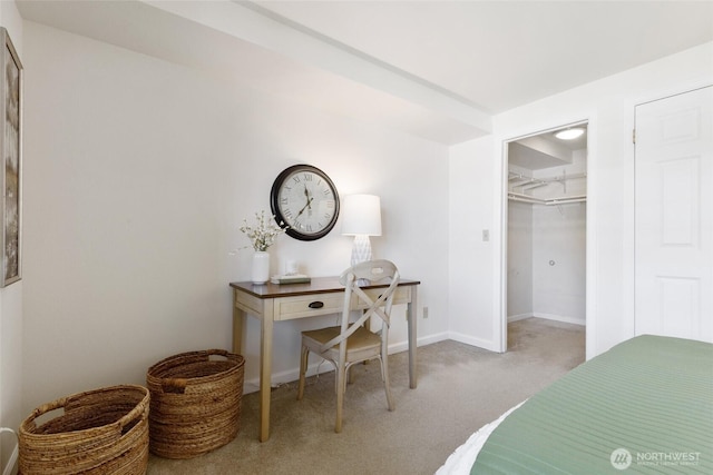 130 NE 95th St Unit A203, Seattle, WA 98115 - bedroom featuring carpet floors, baseboards, a walk in closet, and a closet