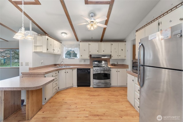 kitchen with under cabinet range hood, a sink, ceiling fan, a peninsula, and appliances with stainless steel finishes