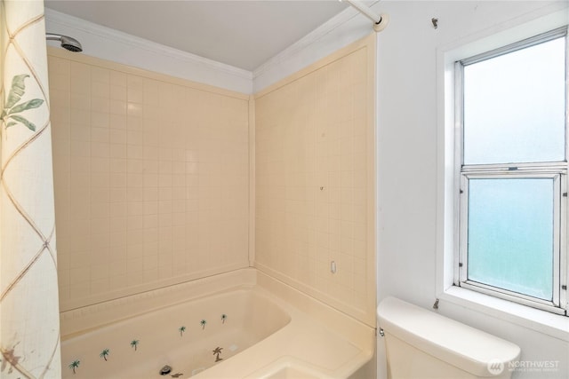 bathroom with crown molding, a combined bath / shower with jetted tub, and toilet