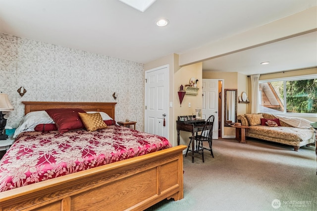 bedroom with light colored carpet, wallpapered walls, baseboards, and recessed lighting