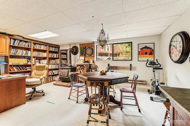 dining area featuring a paneled ceiling